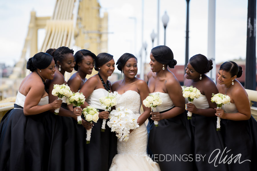 Bridesmaid and bride photos on yellow bridge in Pittsburgh